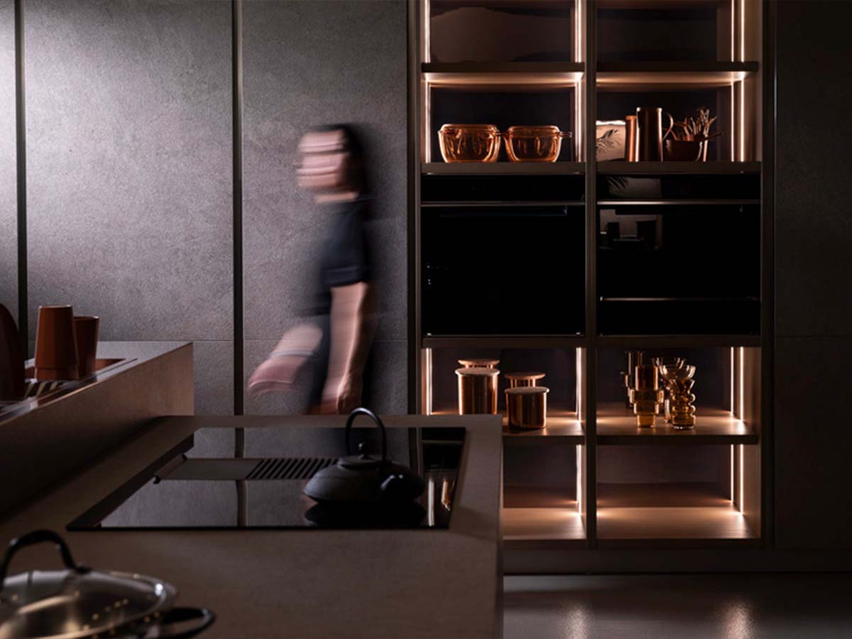 Luxury kitchen with full-height smoked glass wall units and backlit led lighting