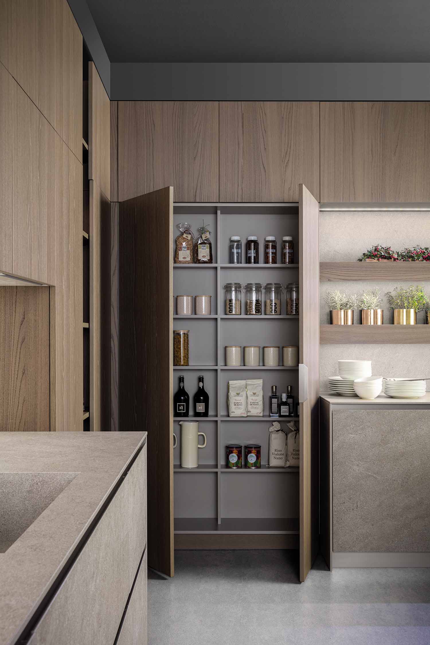 Kitchen 33cm deep tall unit pantry is easily accessible with interior shelves.