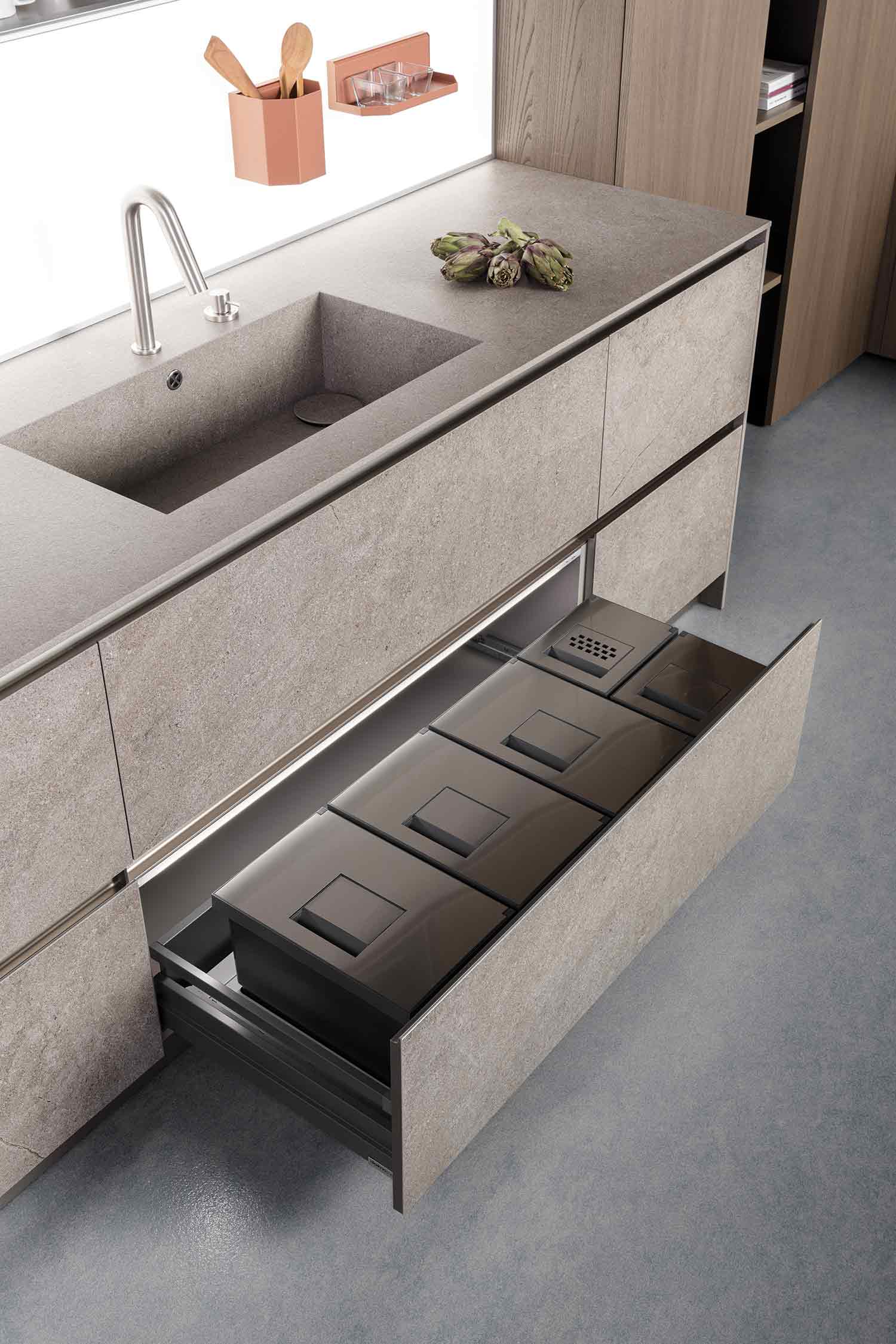 Multi-function refuse and recycling bins equipped within the deep drawer.