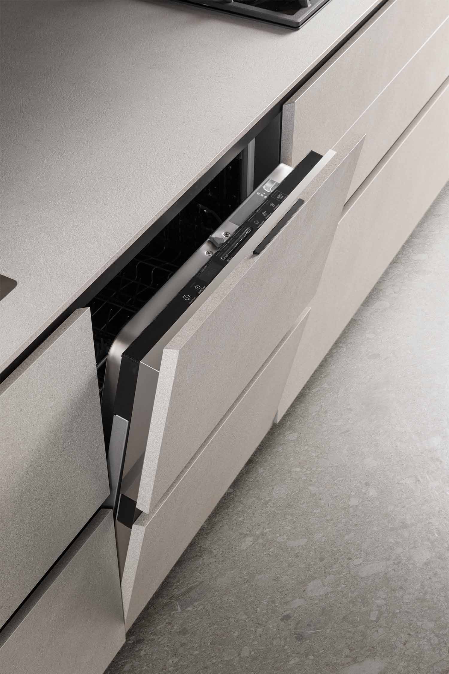 Concealed large appliances are perfectly hidden by the same grooved door design used throughout the kitchen.