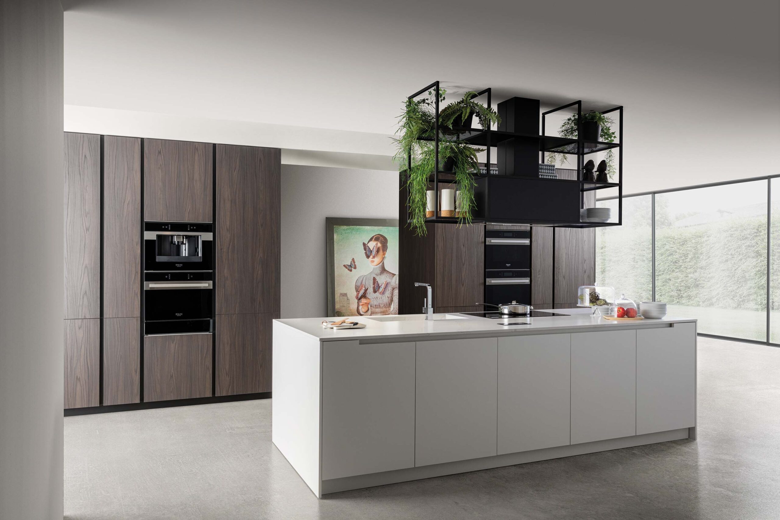 Luxury modern white handleless kitchen with elegant wood veneer and silestone calacatta marble