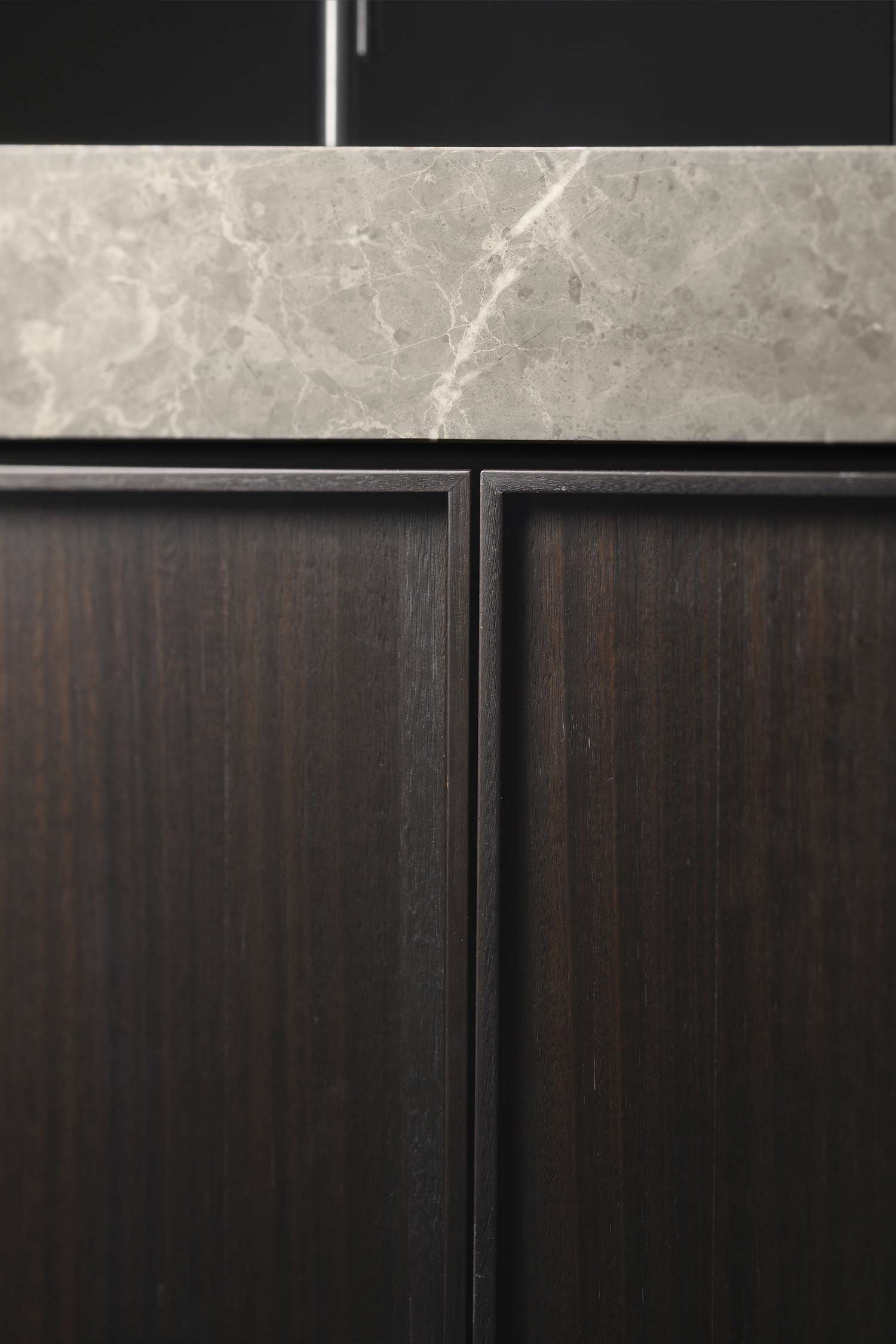 Luxury kitchen tray door finished in Smoked Eucalyptus wood veneer.