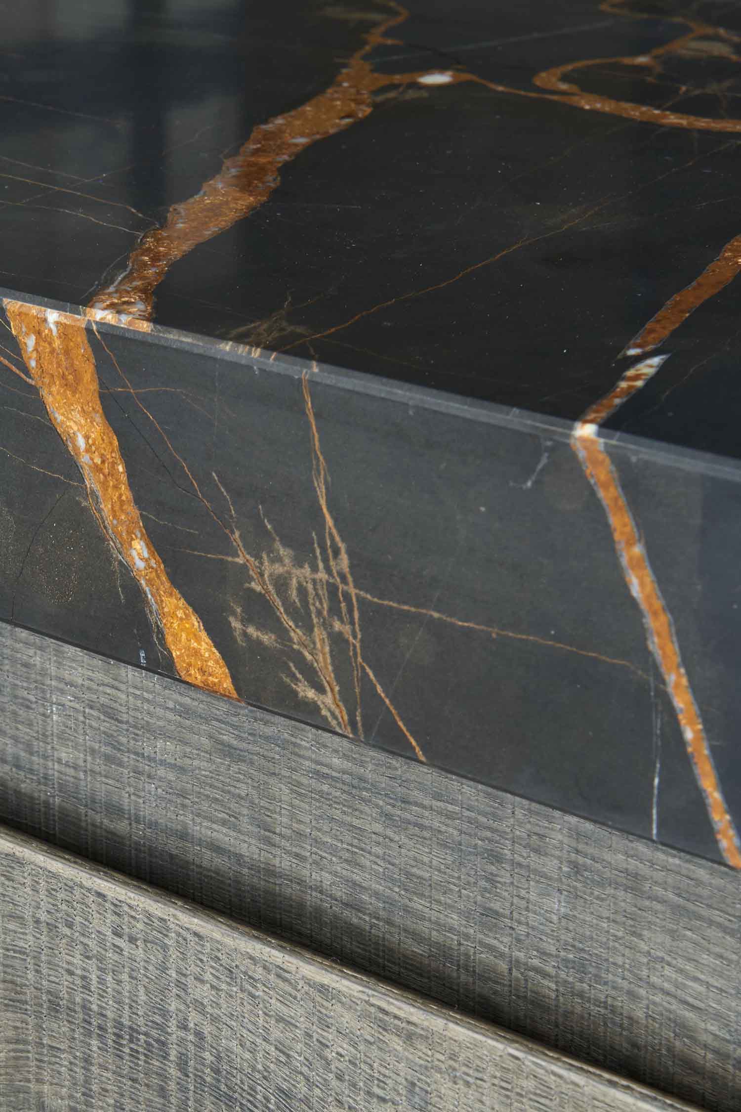 Luxury black Picasso marble kitchen worktop on a large central island.
