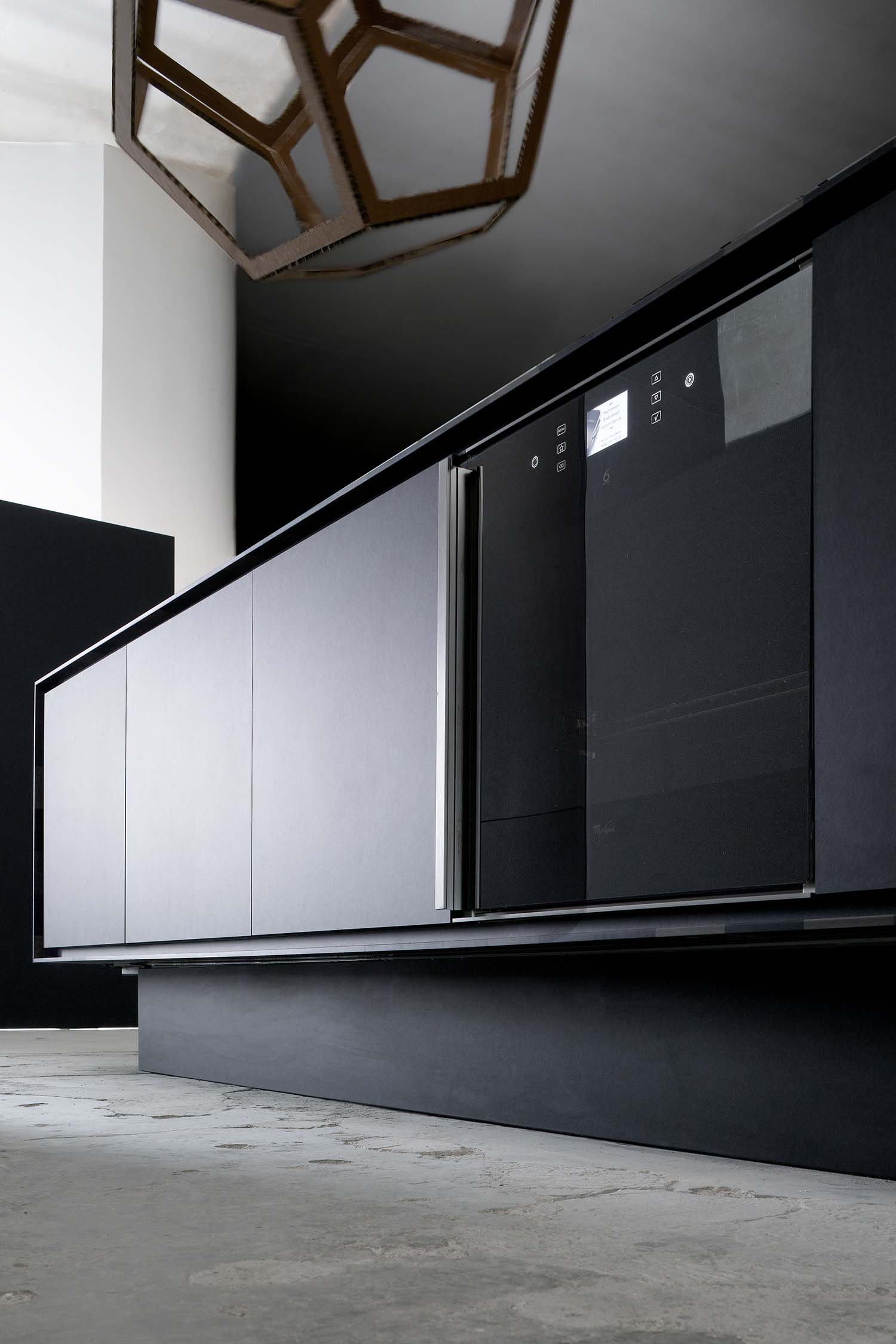Matt finished kitchen doors keep the aesthetic highly modern and give black kitchen appliances a chance to feature.