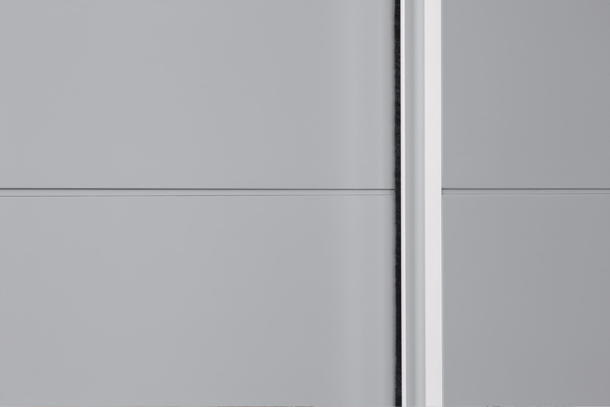 Luxury, minimal sliding wardrobe. Bedroom furniture made in Italy, designed and installed by Krieder UK.
