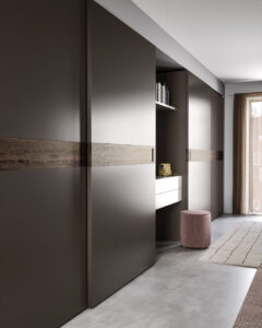 Handcrafted wooden luxury Italian sliding wardrobe with high quality wood. Designed and installed by Krieder for your modern home.