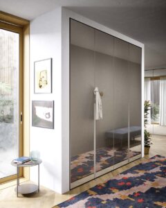 Luxury glass wardrobe with premium Italian glass and hinged doors. Designed and fitted by Krieder.