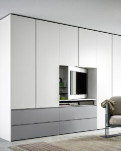 Luxury Italian wardrobe. Modern hinged bedroom wardrobe, complete with media/TV unit built-in. Designed and fitted by Krieder.