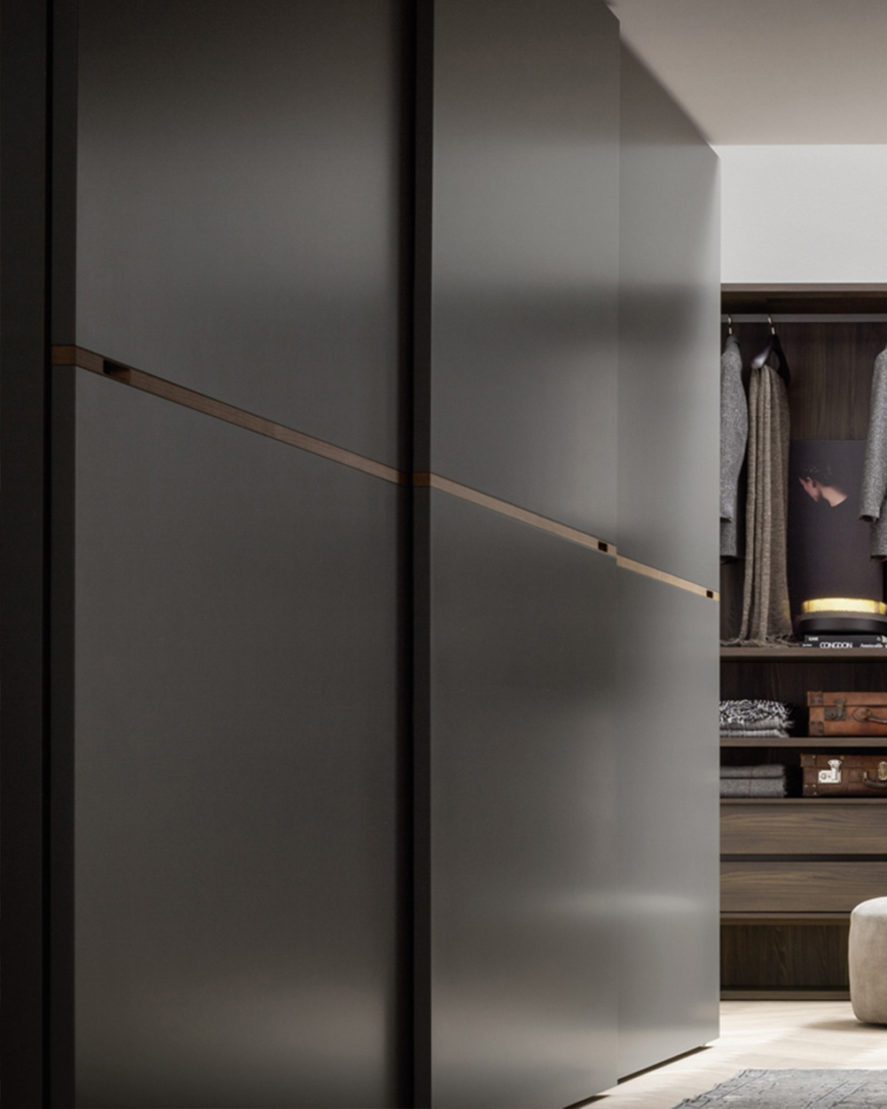 Luxury, minimal sliding wardrobe with central wooden insert. Italian wardrobes, designed and fitted by Krieder.