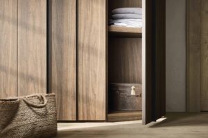 Luxury wooden slated wardrobe designed and fitted by Krieder UK. Luxury modern wardrobe design.