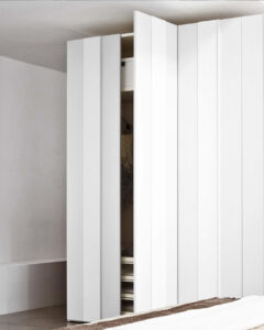 Modern, unique Italian designed bedroom wardrobe with luxury finishes. Designed and fitted by Krieder in the UK.