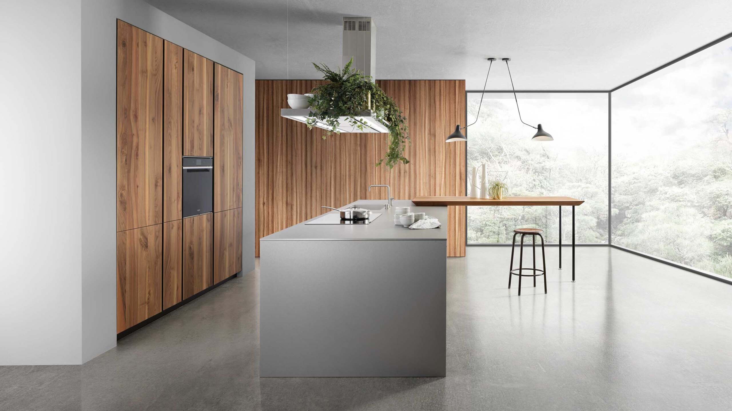 Modern handleless luxury kitchen with warm lighting and clean architectural lines