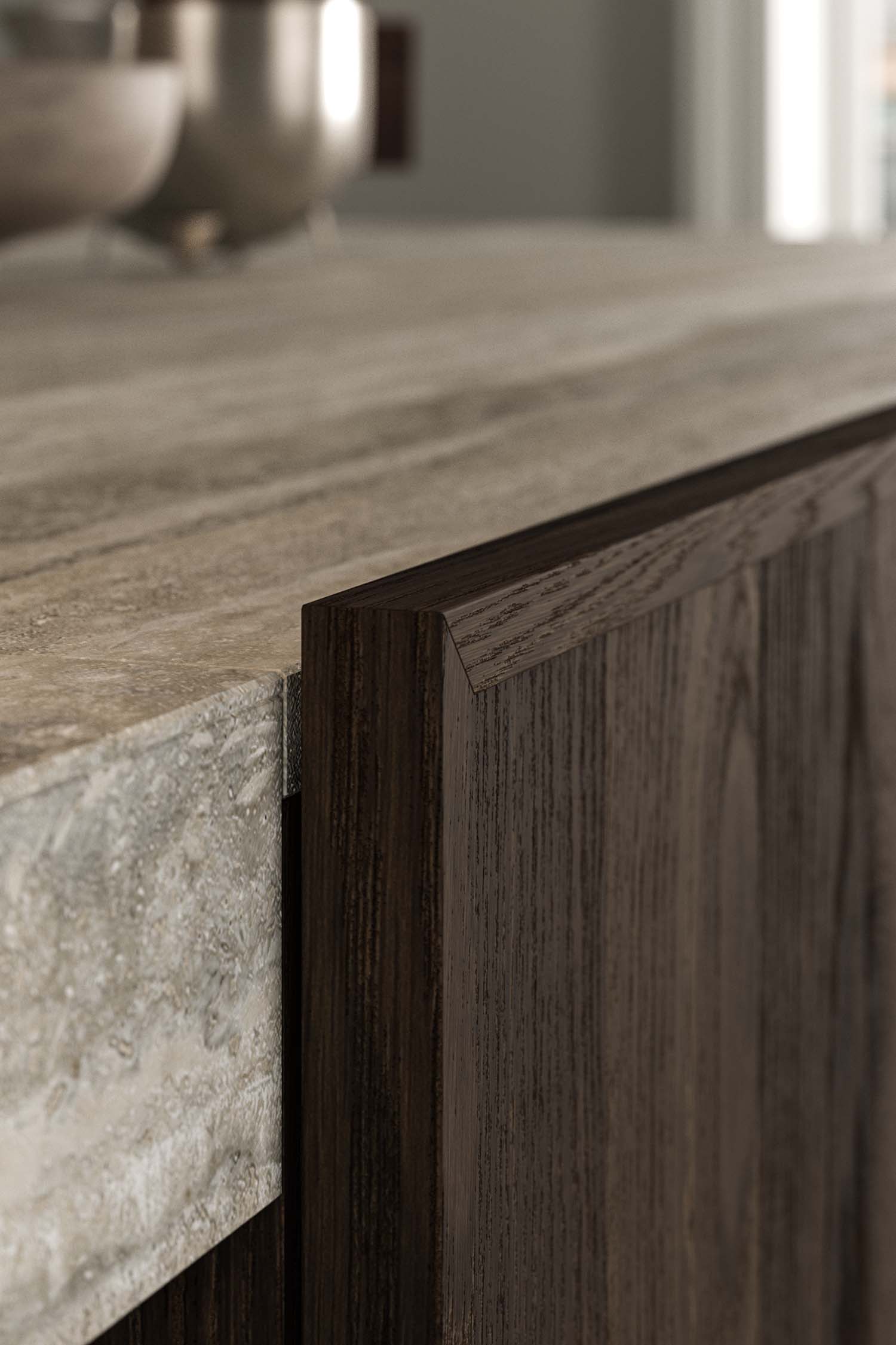 A close-up, high-angle view of a sleek, black kitchen hob with four integrated cooking zones, set flush into a dark grey or black countertop.