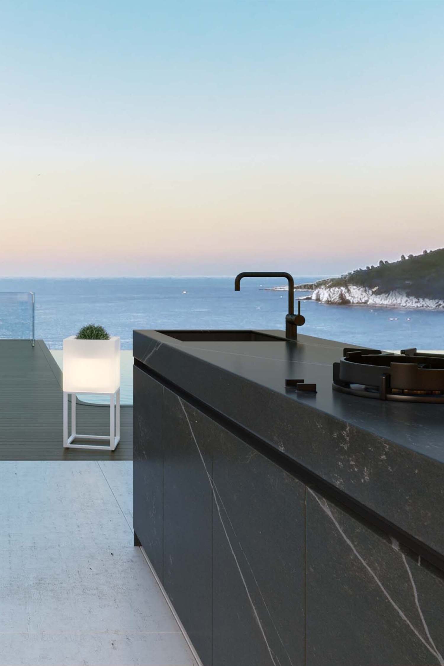 Vertical view of a sleek, contemporary outdoor kitchen console unit designed for a luxury patio or garden space.