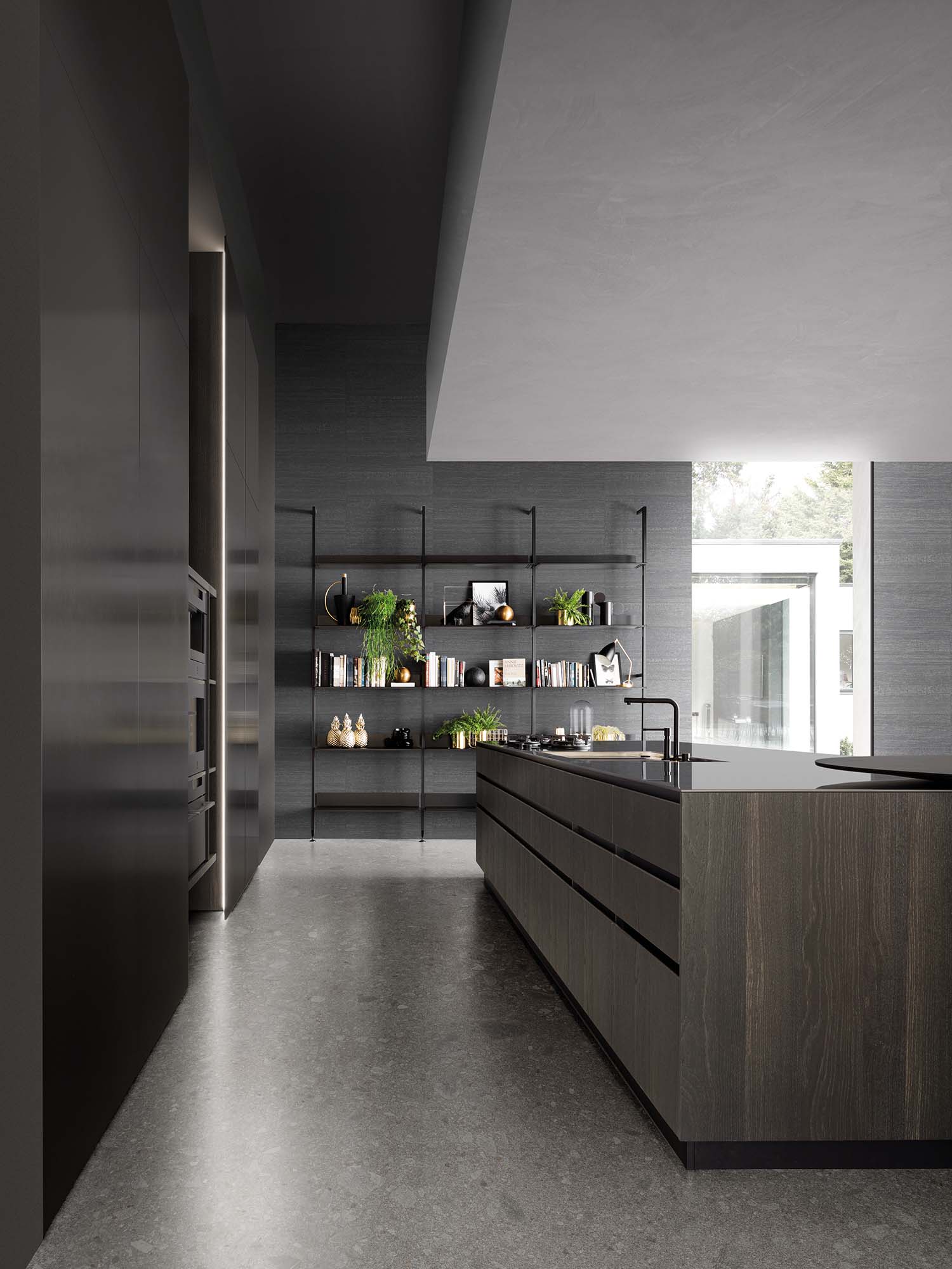An open kitchen cabinet drawer with a wooden cutlery divider. The dividers are precisely cut to organize various utensils, demonstrating a high-end, bespoke interior.