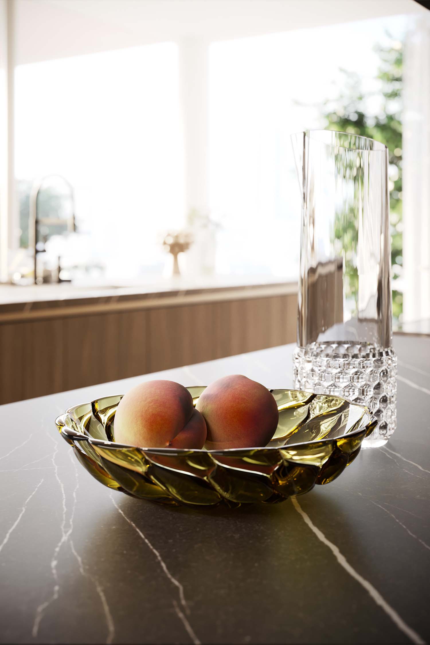 A close-up view of a minimalist kitchen's interior cabinet, which is a drawer with a pull-out wooden divider. The dividers organize an assortment of kitchen tools and cutlery, demonstrating the efficient, bespoke interior storage solution.