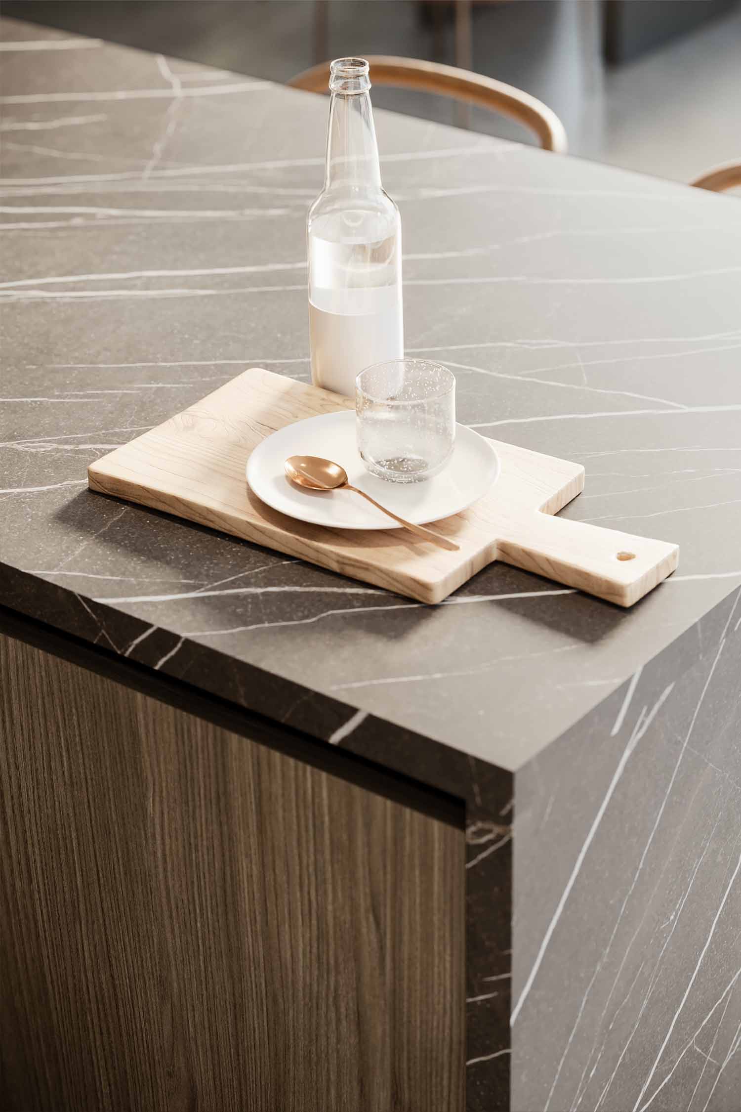 A wide shot of a luxury, contemporary kitchen featuring a dark wooden island with an integrated dining or breakfast area and a light-colored stone countertop. The floor-to-ceiling cabinetry is a mix of dark wood veneer and a light, concrete-like finish. A large slatted wood feature wall and a circular ceiling light fixture complete the space.