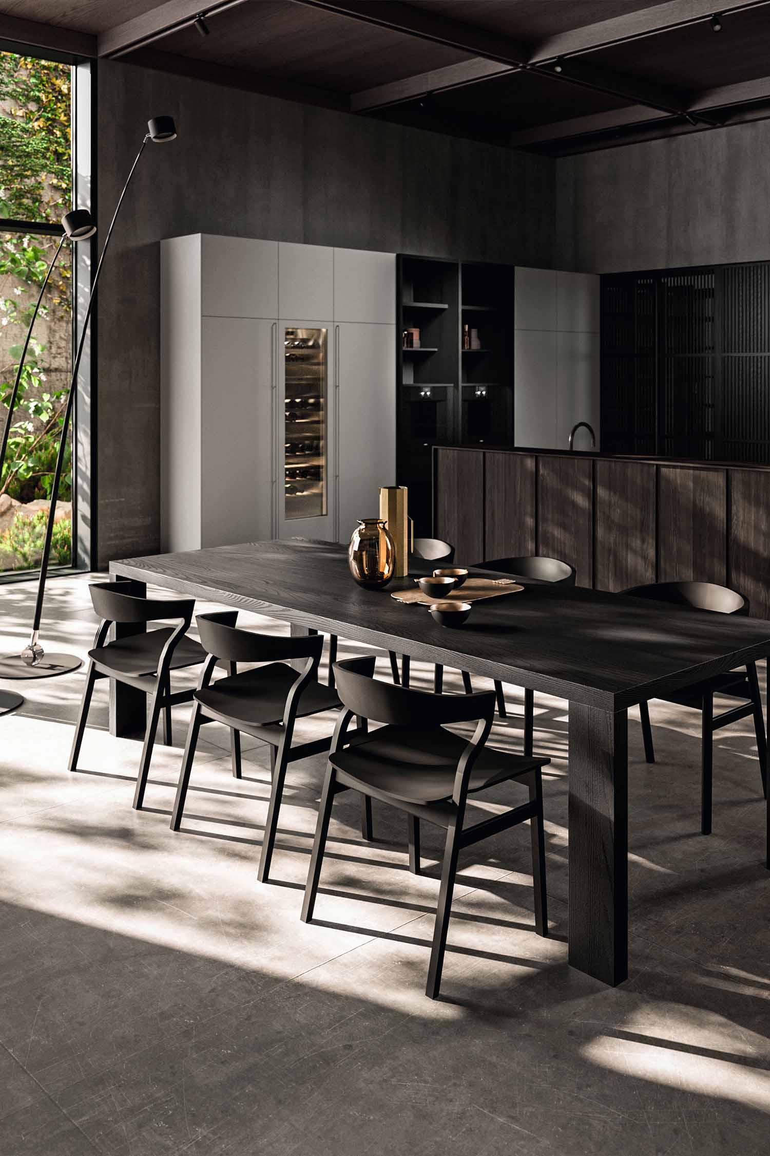 A close-up of the subtle recessed finger pull on a kitchen cabinet. The photo highlights the sleek, handles-free design and the clean lines of the drawer face.