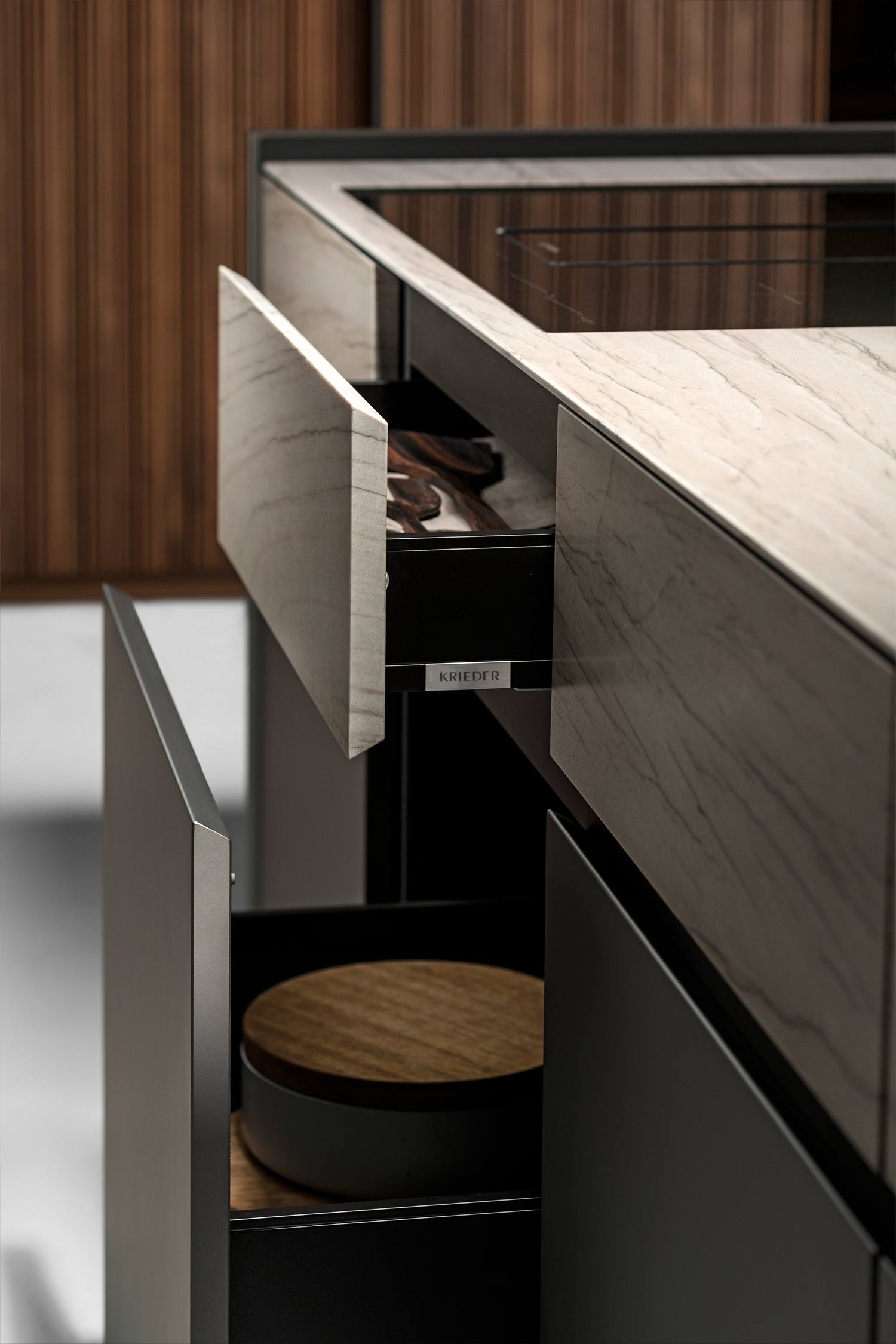 A detailed image focusing on a white, stone-like backsplash with a subtle texture and a visible seam or joint line.