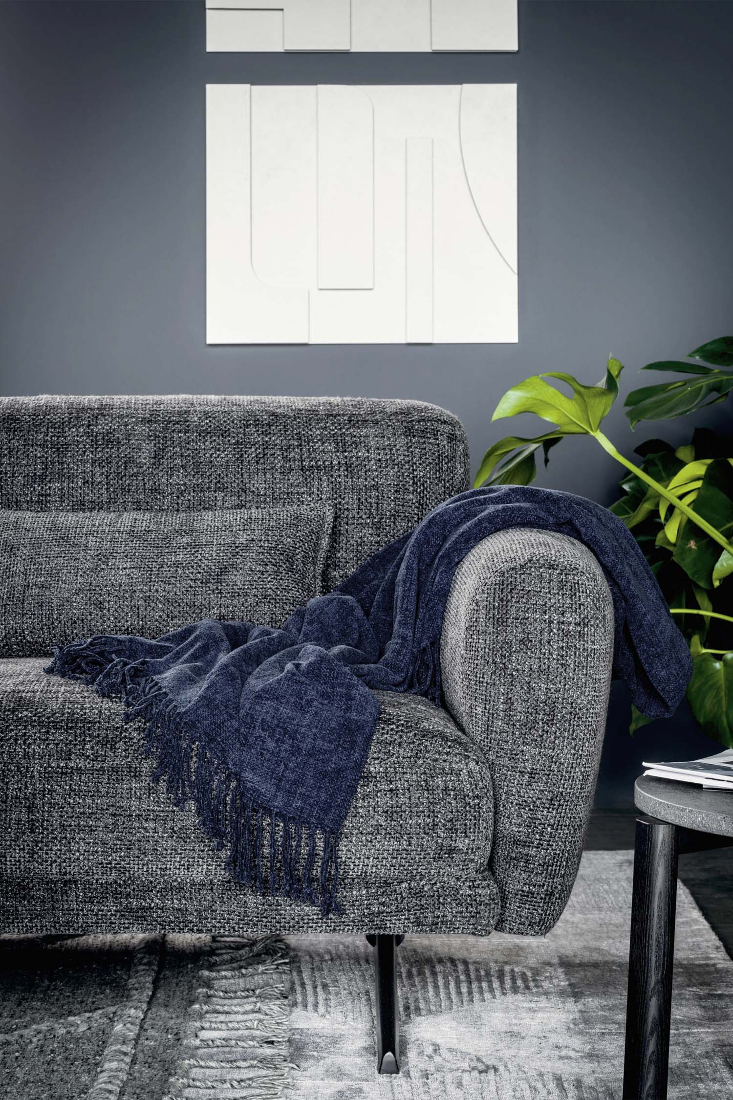 An extreme close-up of the fabric texture on a beige sofa cushion. The photo highlights the fine weave and soft, tactile quality of the upholstery.