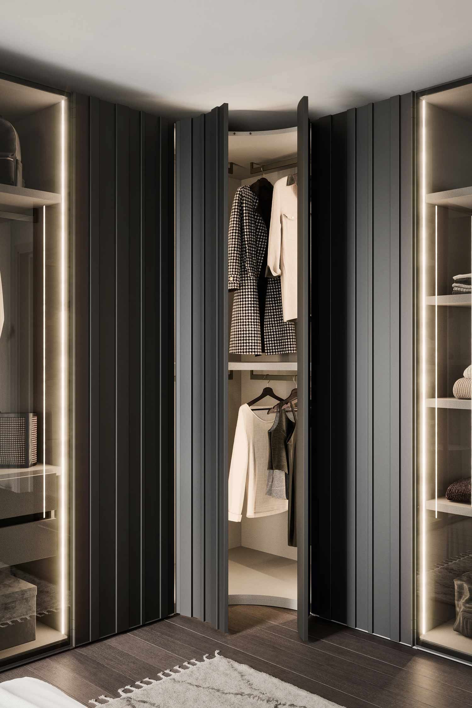 A detailed view of a dark, curved wardrobe with hinged doors that open to reveal an illuminated interior with hanging clothes. The design features vertical slats and is flanked by lit, glass-fronted closet sections.