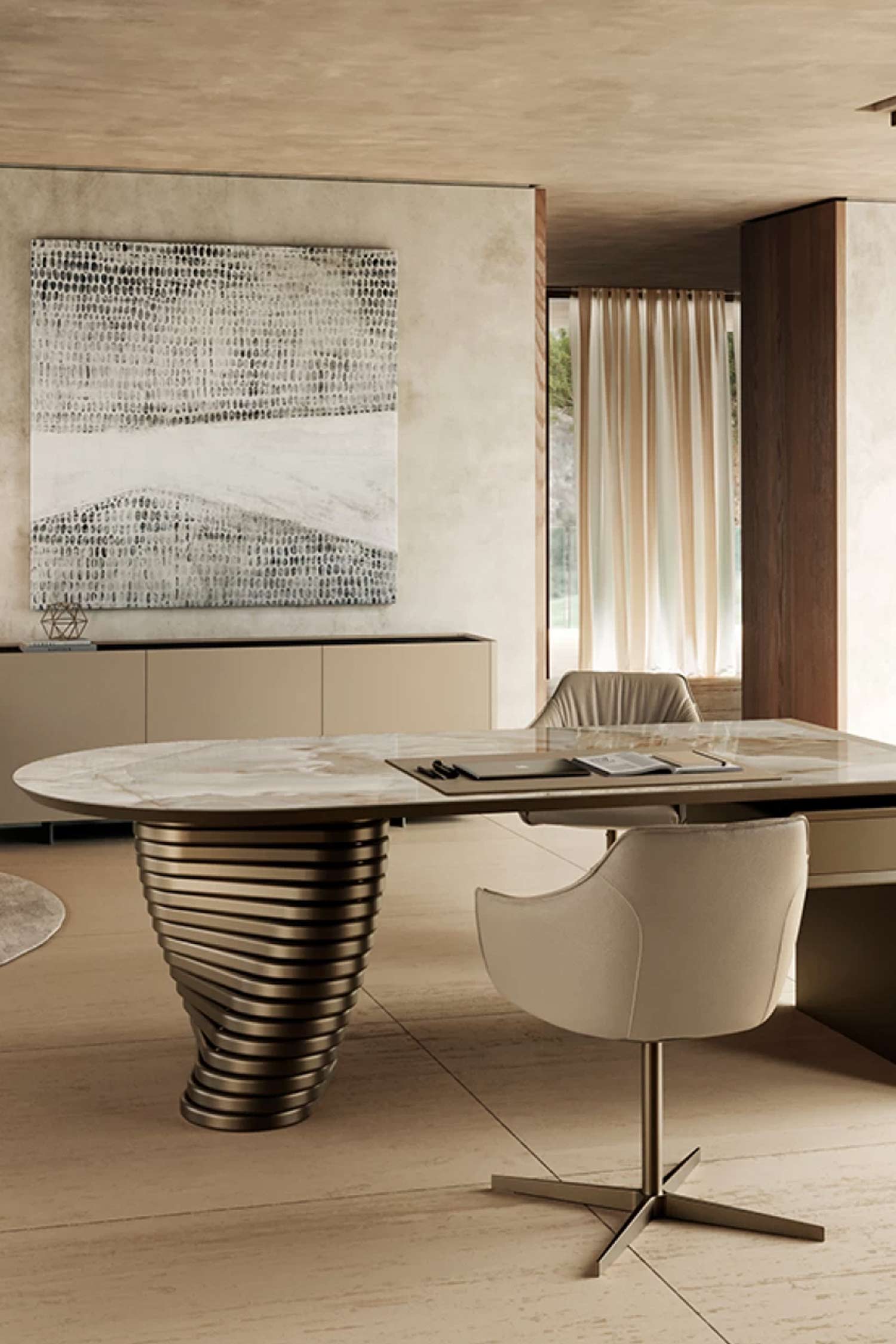Close-up of the Rotolo luxury desk showing the oval marble tabletop and the bronze, sculptural spiral base in a neutrally decorated office. A credenza with a large abstract painting hangs on the wall behind the desk.