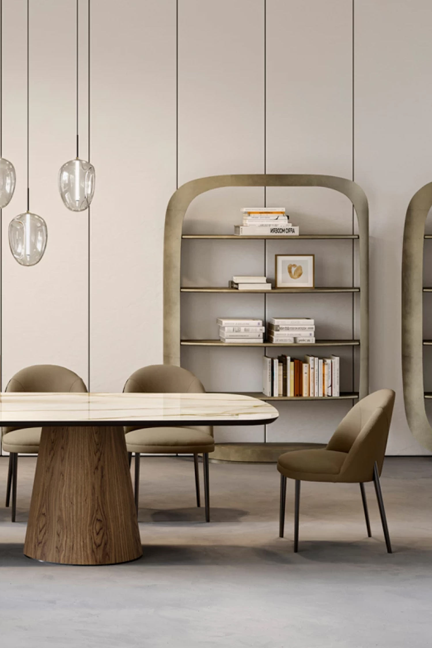 A detail shot of a modern dining room focusing on a segment of the wood-based dining table and an adjacent rounded, arching display shelf unit. Two tan upholstered dining chairs are visible, along with three hanging clear glass pendant lights. The wall is light beige with vertical panels.