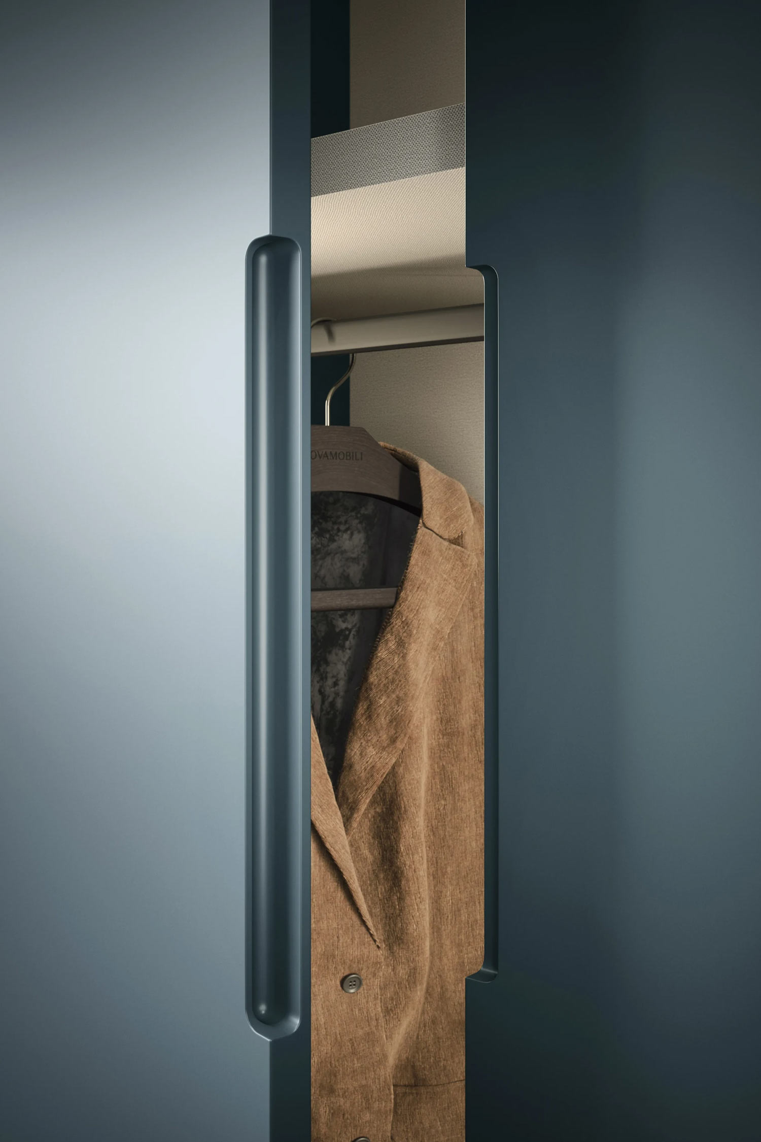 This image shows a close-up of a dark, cylindrical wardrobe handle on a matte blue-gray door. The door is slightly ajar, revealing a brown jacket hanging inside the wardrobe.