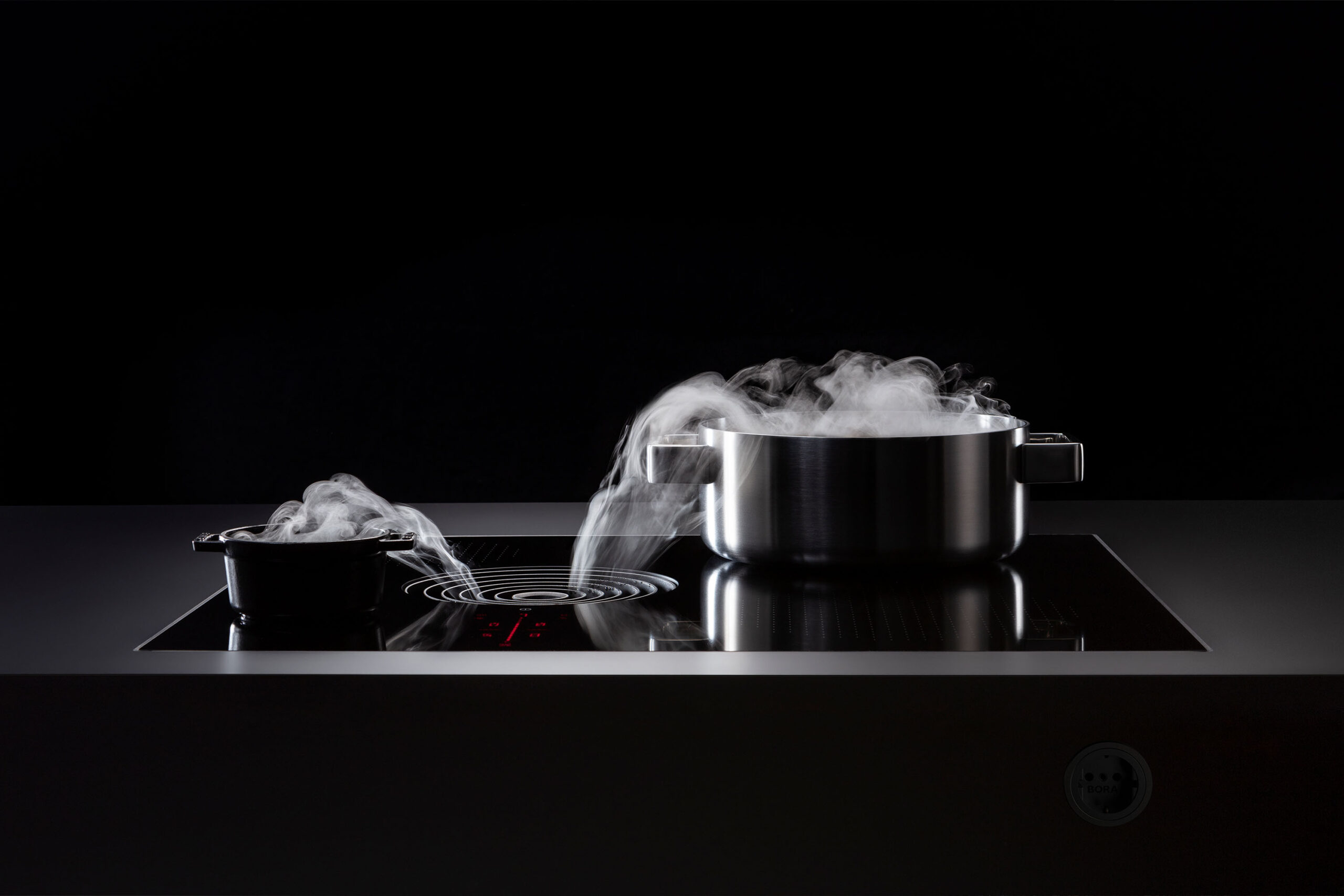 Side view showing steam being drawn from a pan into the Pure S extractor.