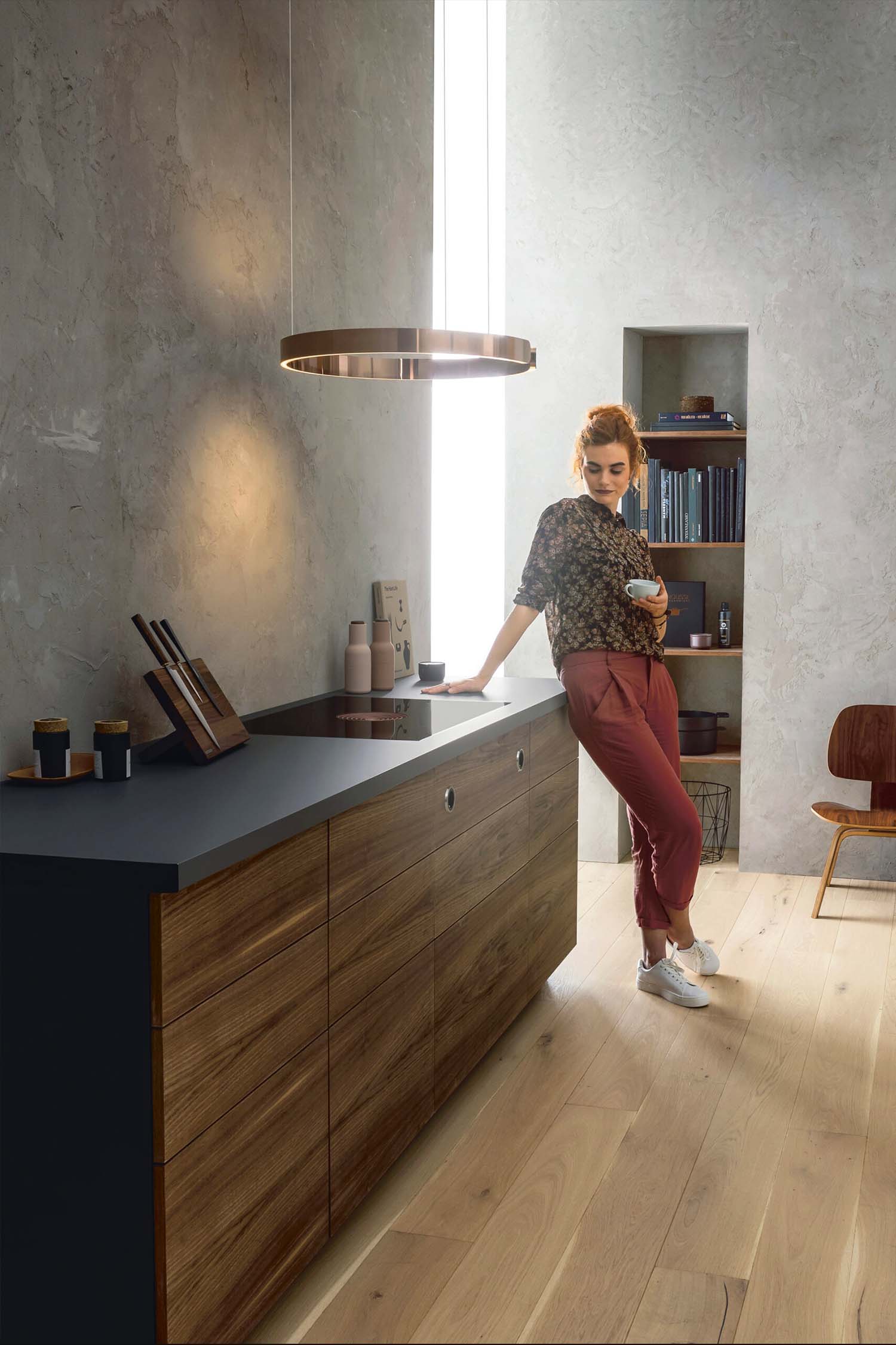 Modern open-plan kitchen with a BORA Pure cooktop centred on a minimalist island.