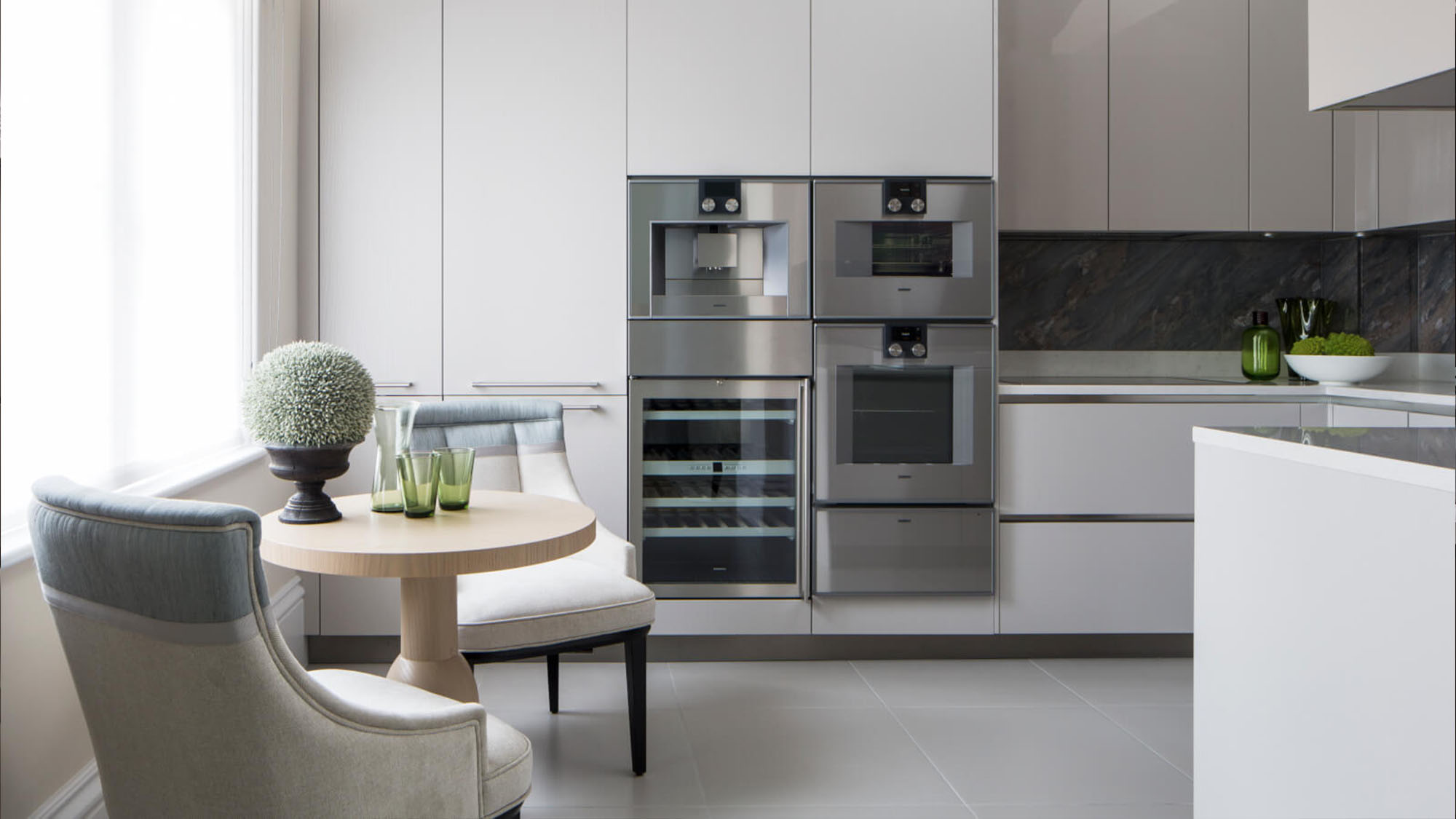 Open-plan luxury kitchen with integrated appliances, island and refined modern layout