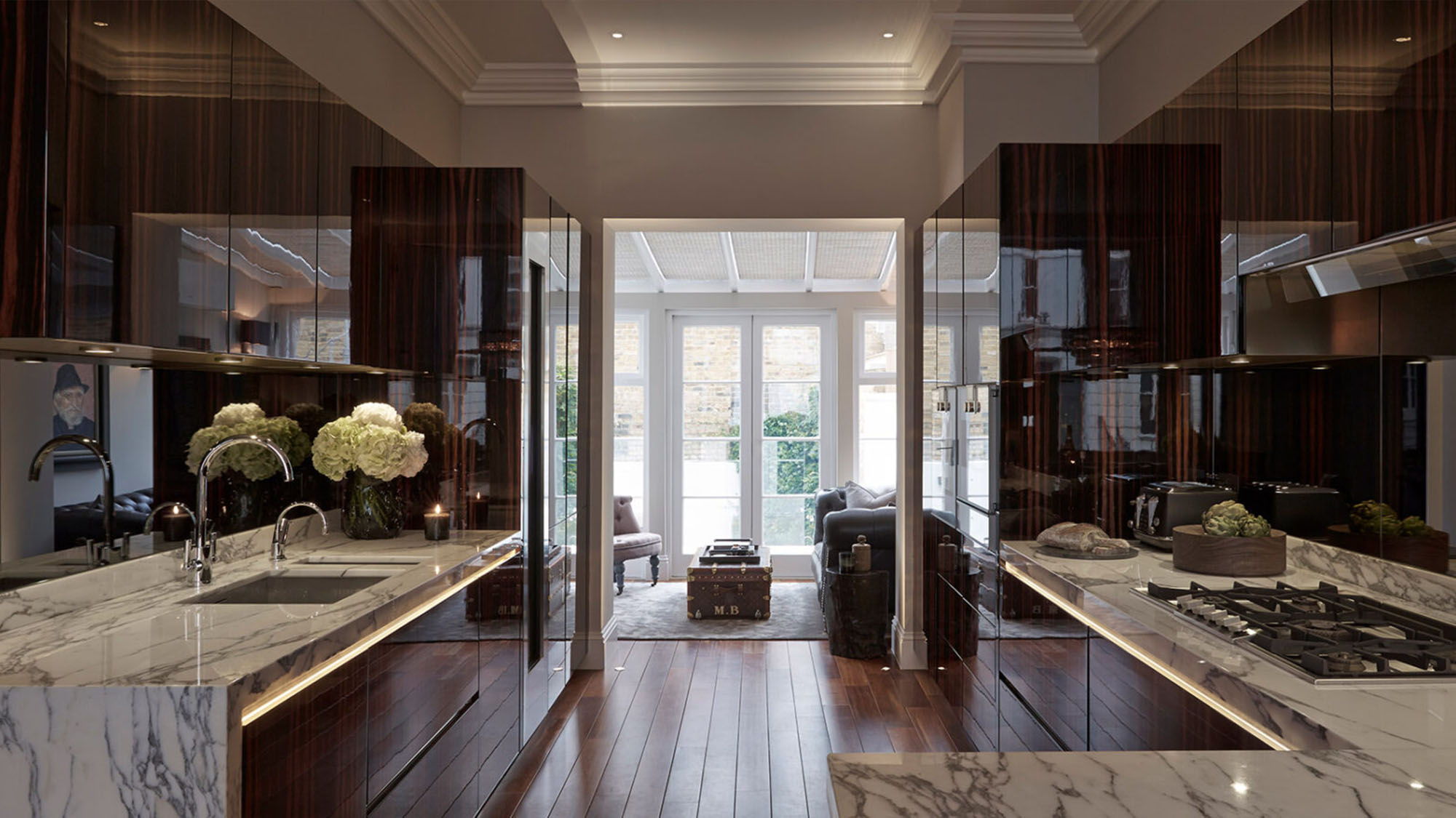 Elegant luxury kitchen with timeless finishes, soft lighting and refined detailing