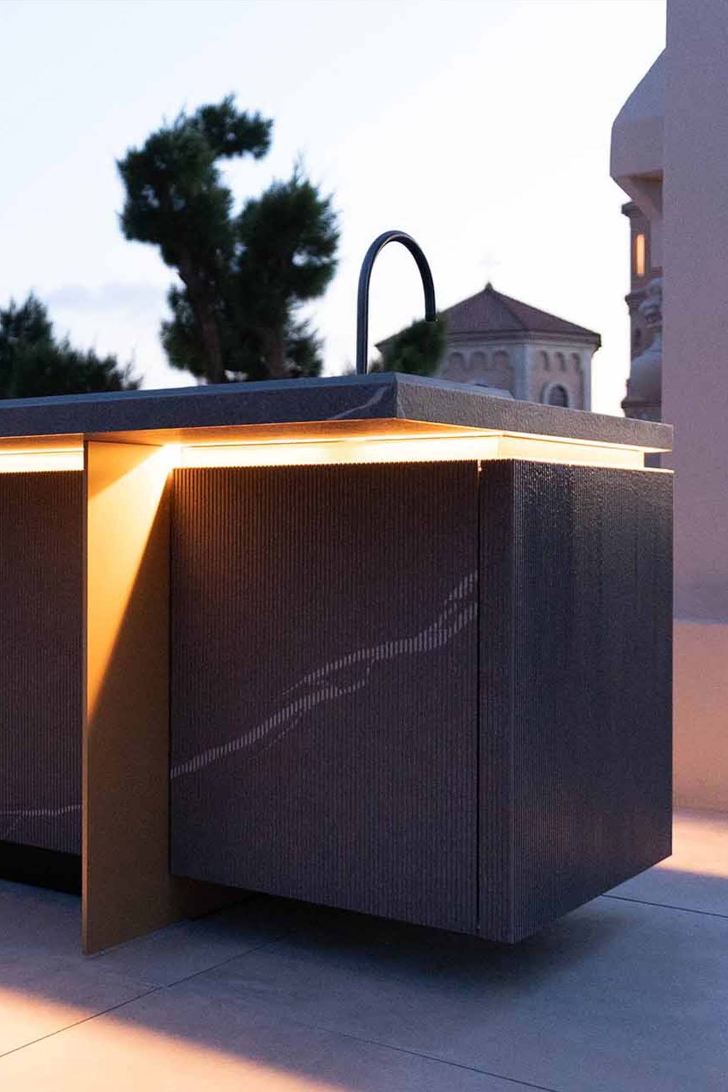 ertical view of the dark, sleek luxury outdoor kitchen console unit, emphasizing its minimalist design and premium construction.