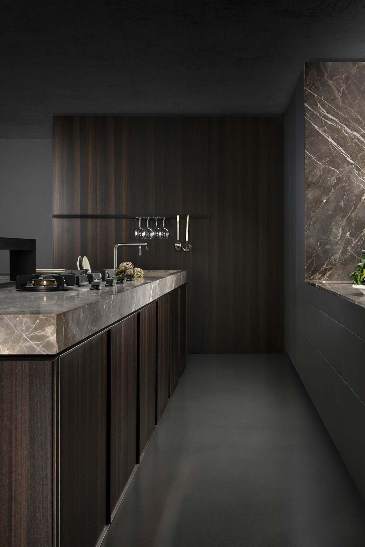 Handleless luxury kitchen with integrated Gaggenau appliances and floor-to-ceiling glazing in Chislehurst home by Krieder Studio