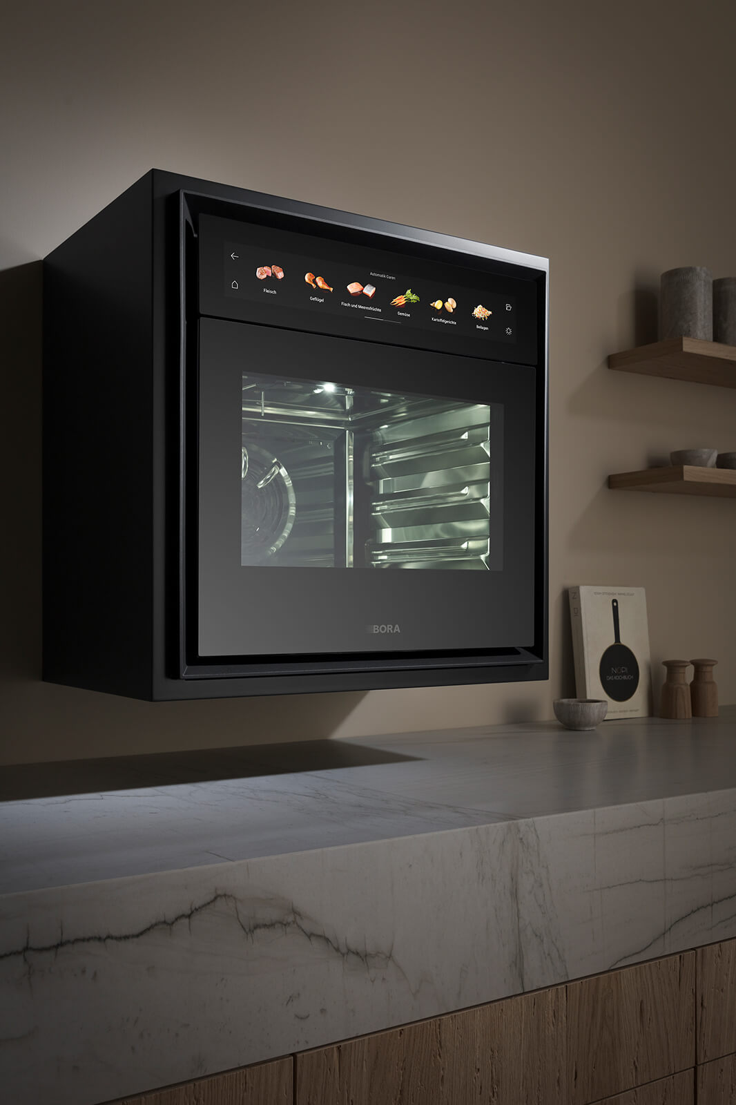 Integrated BORA X BO professional steam oven in elegant black glass, flush-mounted into tall cabinetry with a vibrant touchscreen displaying cooking modes, reflecting ambient light in a contemporary chef-style kitchen.