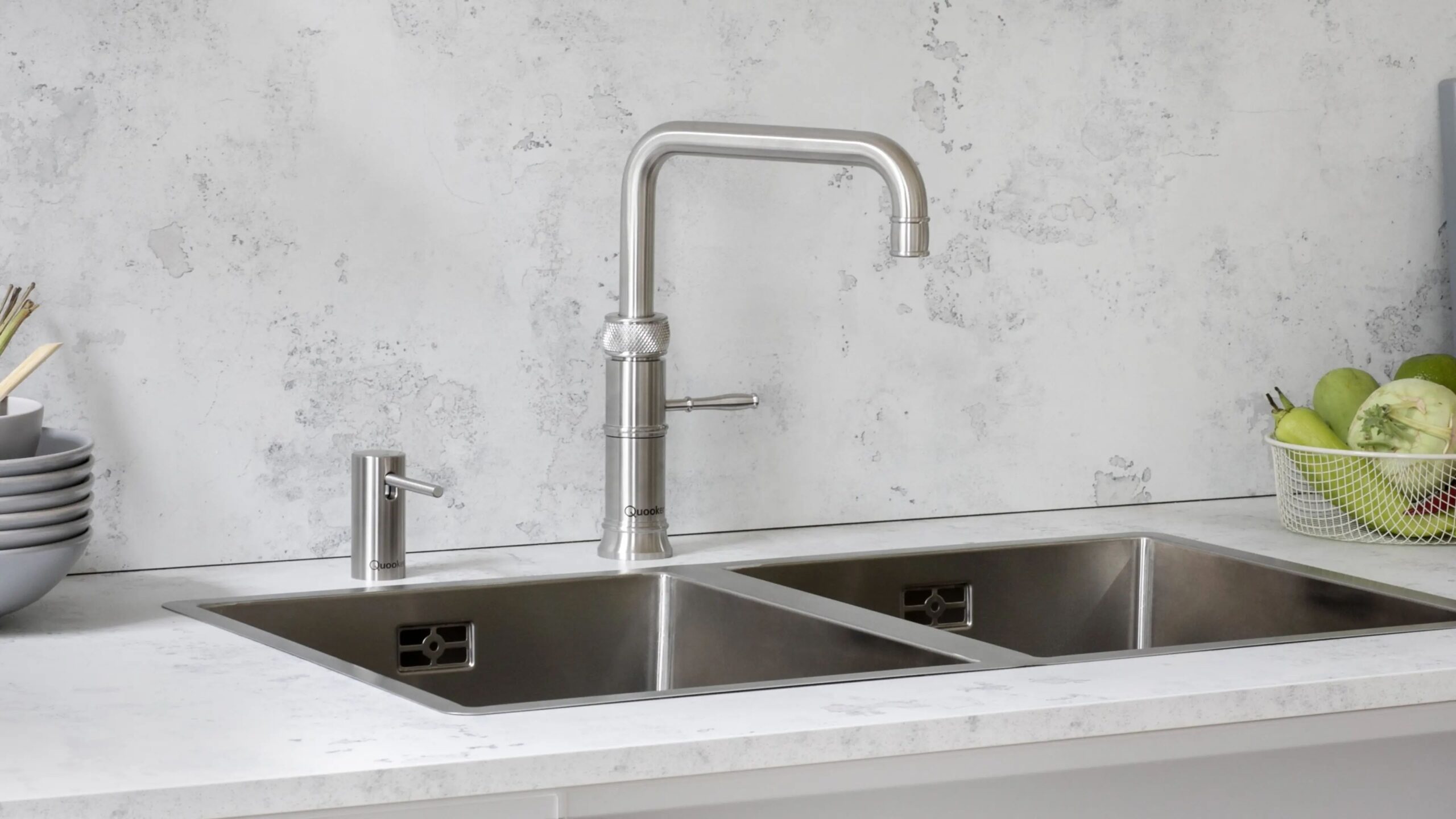 Quooker tap on stainless steel sink with marble worktop