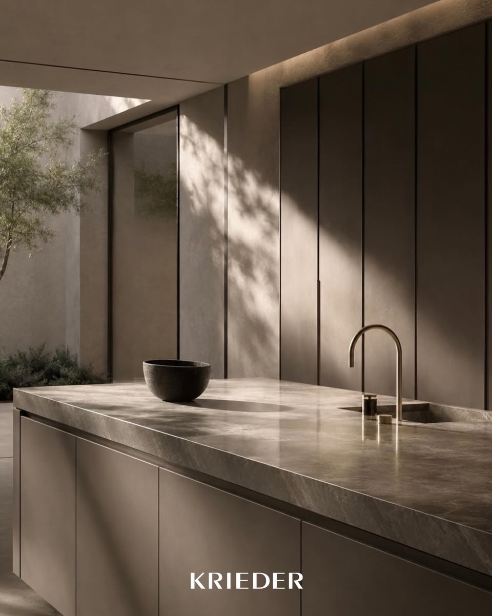 Minimal kitchen tap integrated into a luxury kitchen island